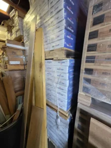 A photo of pallets of Mohawk Quick Step flooring